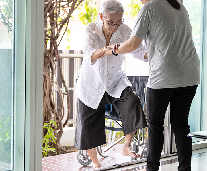 woman holding hands of the old elderly for support