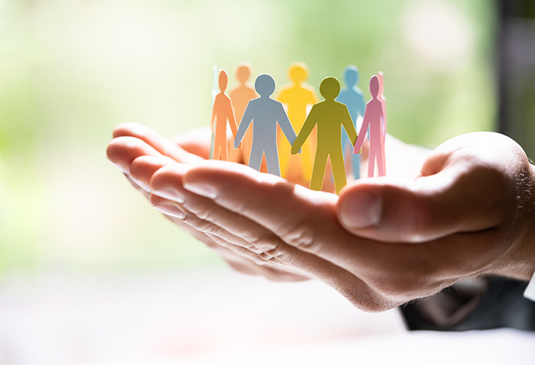 people holding hands in a circle