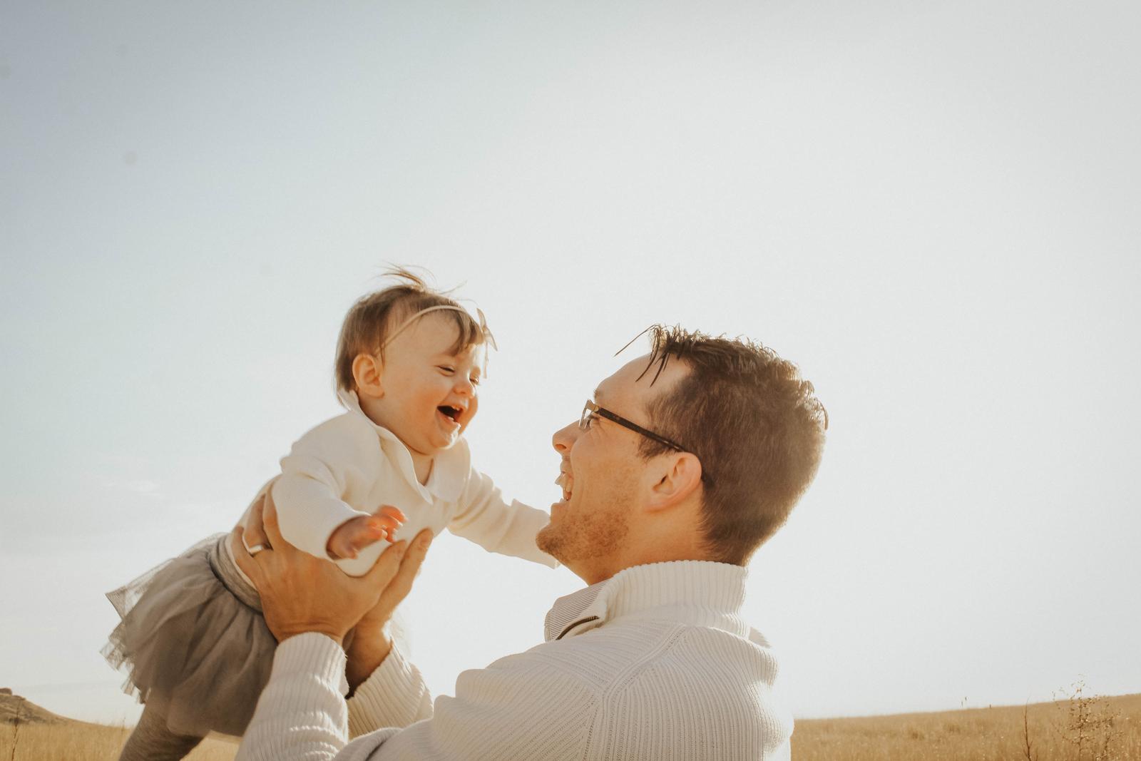 Father holding young child